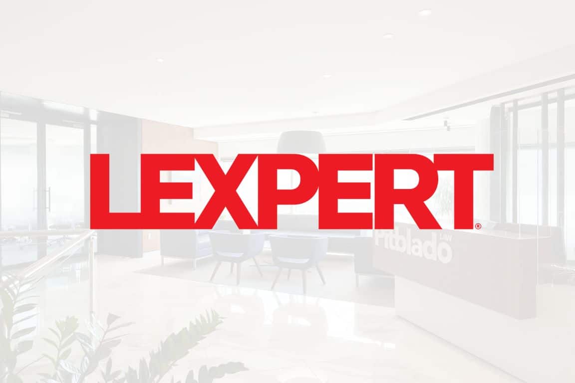 LEXPERT logo displayed prominently in a modern lobby, featuring a red font on a light background.