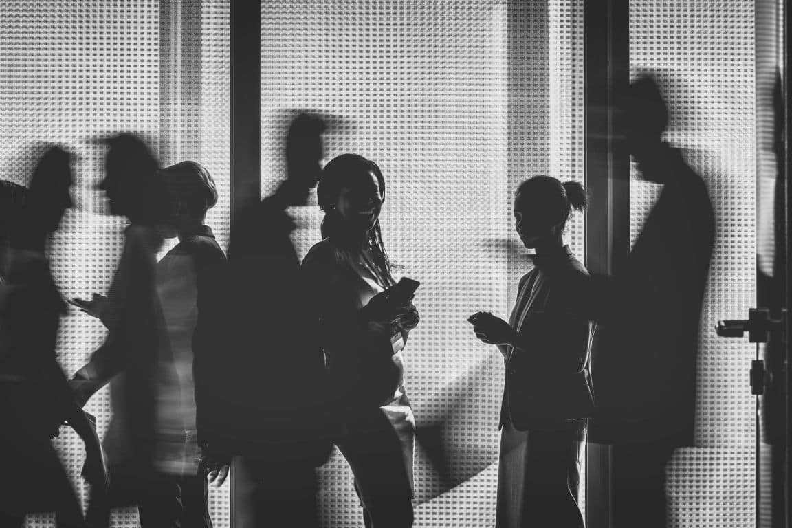 silhouette of a busy office hallway