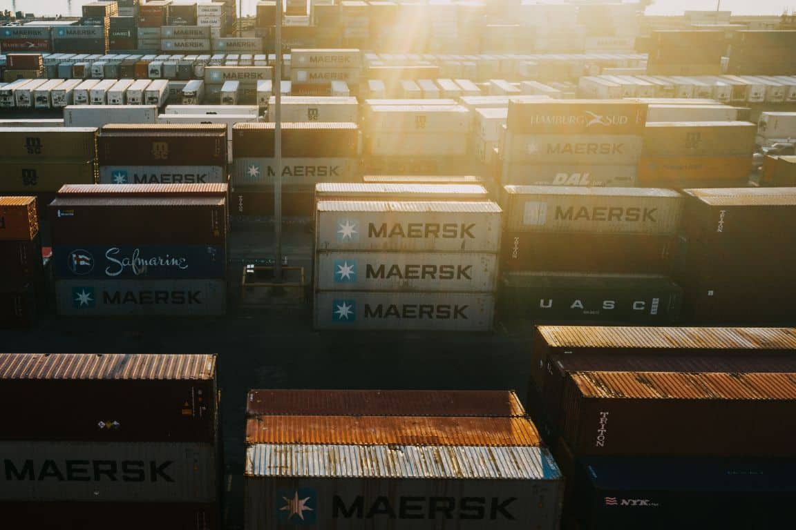Shipping containers in a shipping yard at sunrise